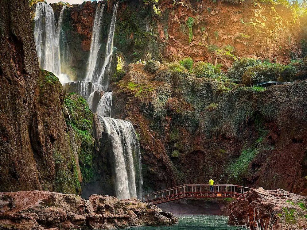 The Ouzoud waterfalls seen from below, with the footbridge and the pool