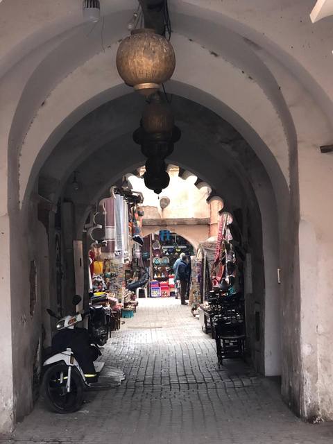 Brass lanterns hanging in an archway of the souks