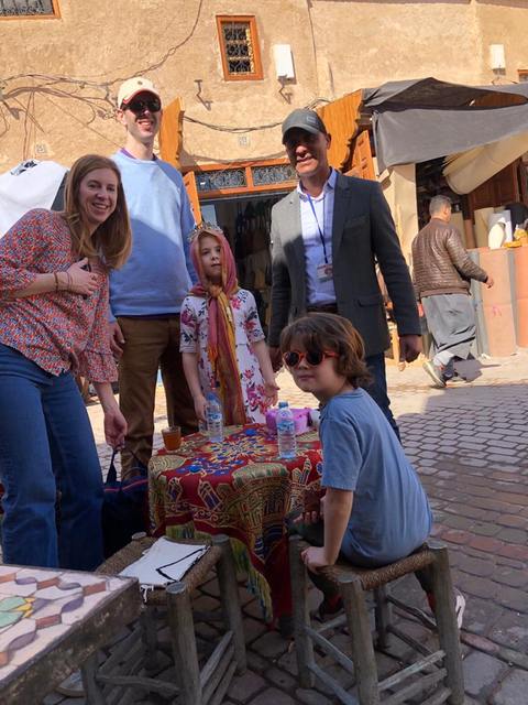 A family with two children at a tea table in the souk