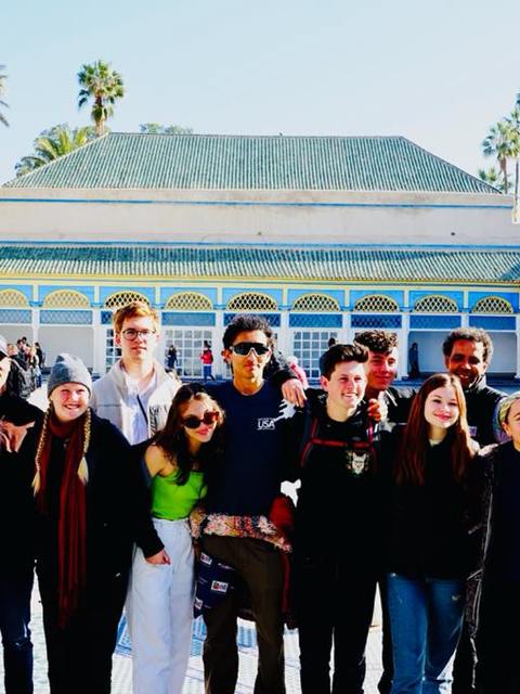 A student group with Adil in the courtyard of the Bahia Palace