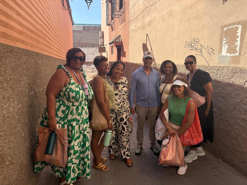 Adil and a group of guests in a medina alley